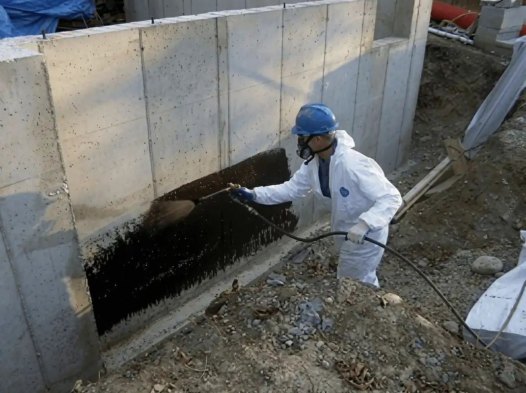 Professional waterproofing the exterior walls of the basement in Arlington, TX
