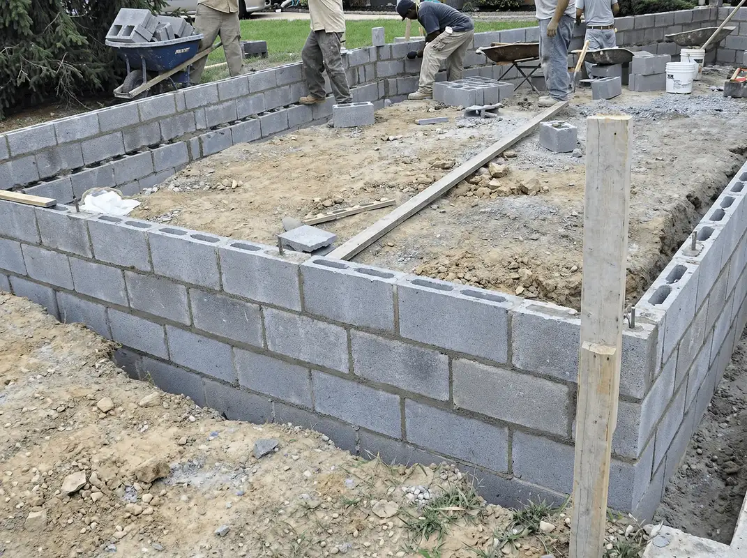 Professionals building a foundation with blocks in Arlington, TX