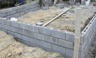 Professionals building a foundation with blocks in Arlington, TX