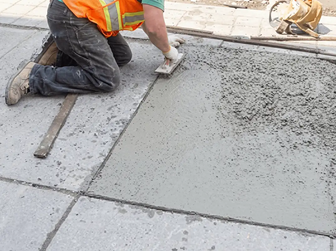 Professional repairing a concrete floor in Arlington, TX