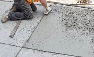 Professional repairing a concrete floor in Arlington, TX
